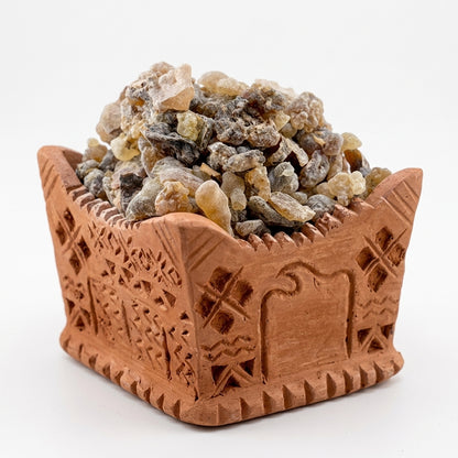 Traditional Omani Mabkhara filled with black hojari frankincense